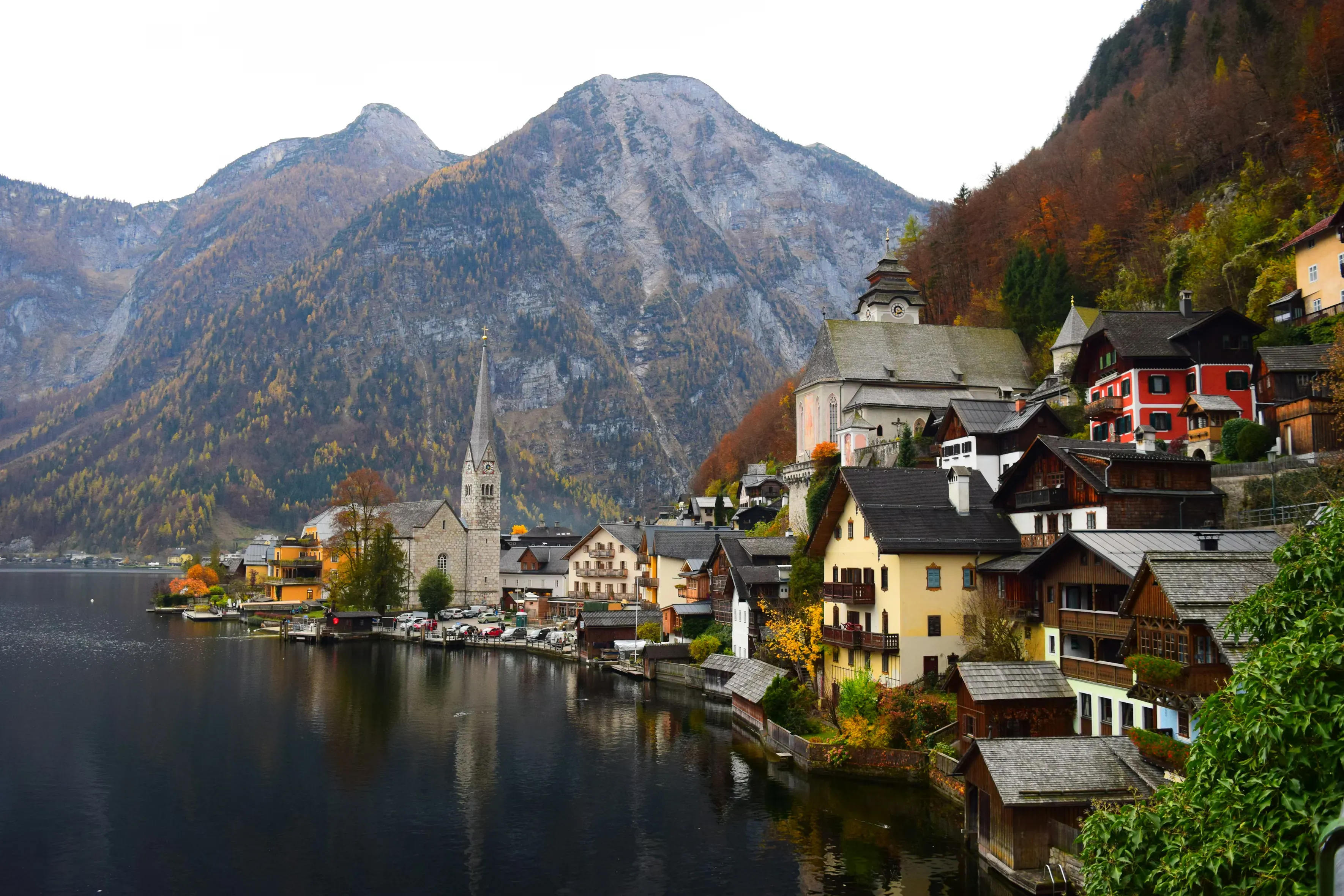 Lakeside village of Hallstatt, Austria nestled beneath alpine mountains in autumn